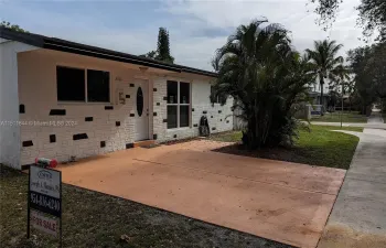 This home has great curb appeal with fresh paint and big shady trees.