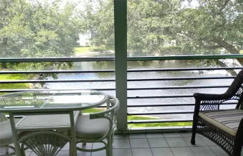 Tranquil lake waterview from screened in patio.