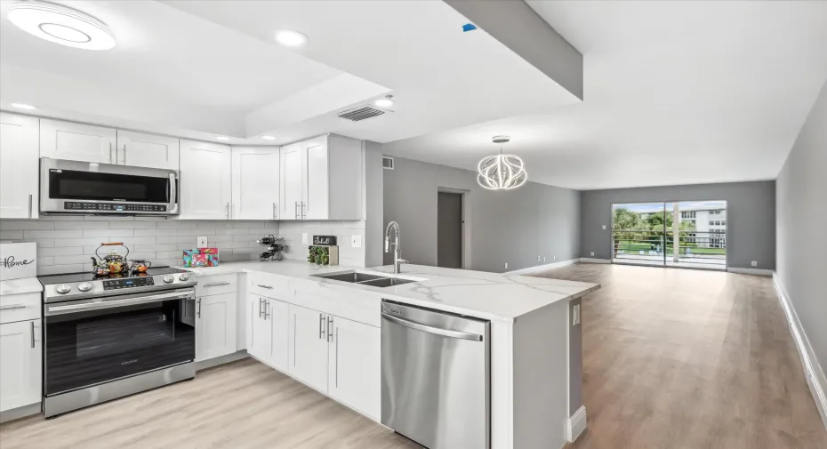 BEAUTIFULLY REMODELED KITCHEN FEATURES EXTENDED CABINETRY, FRENCH DOOR REFRIGERATOR, LED LIGHTING