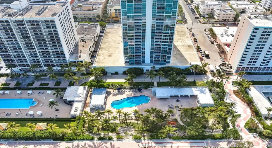 Direct oceanfront building; pool and boardwalk.