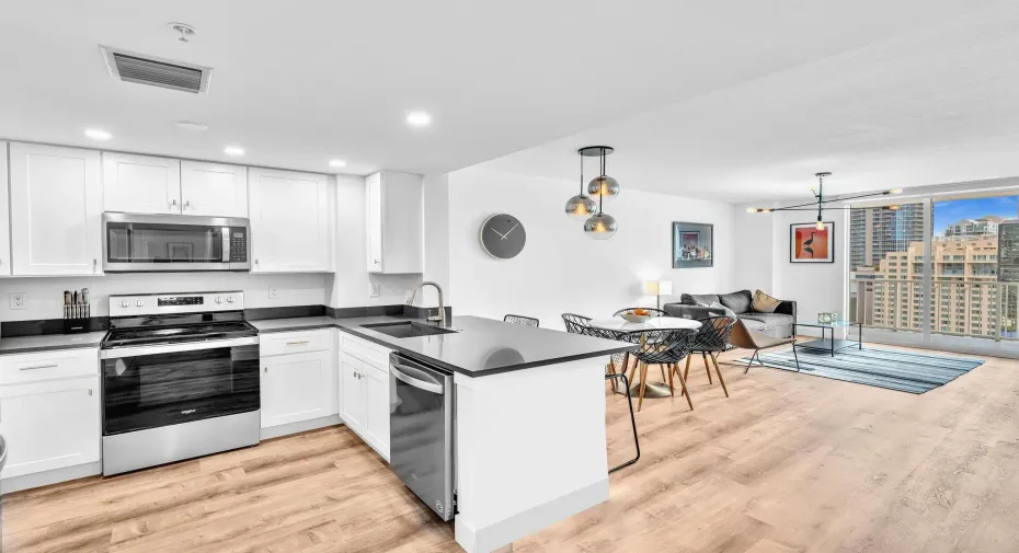 Remodeled OPEN kitchen with snack/bar counter for seating.