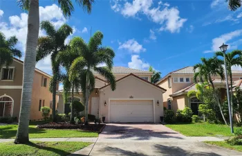 GORGEOUS 2-STORY HOME SWEET HOME!  Front North exposure, paved driveway laced w/ palm trees!